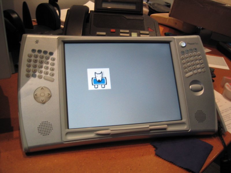 Pepper Pad 2, freshly unboxed showing an early boot screen while sitting on my work desk, circa 2005.
